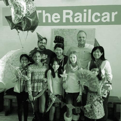 Family Posing For Picture At The Railcar Escape Room